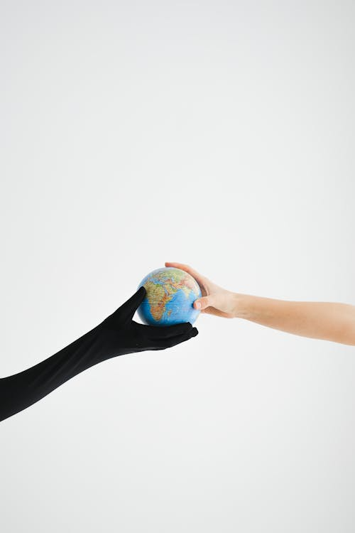 Hands holding a globe